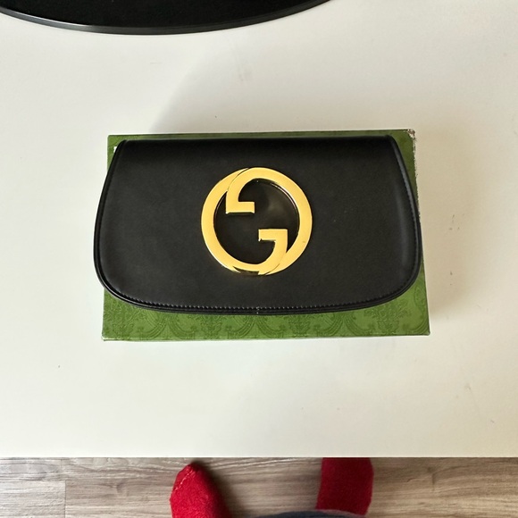 Gucci Handbags - Gucci Black Bag with Gold Emblem